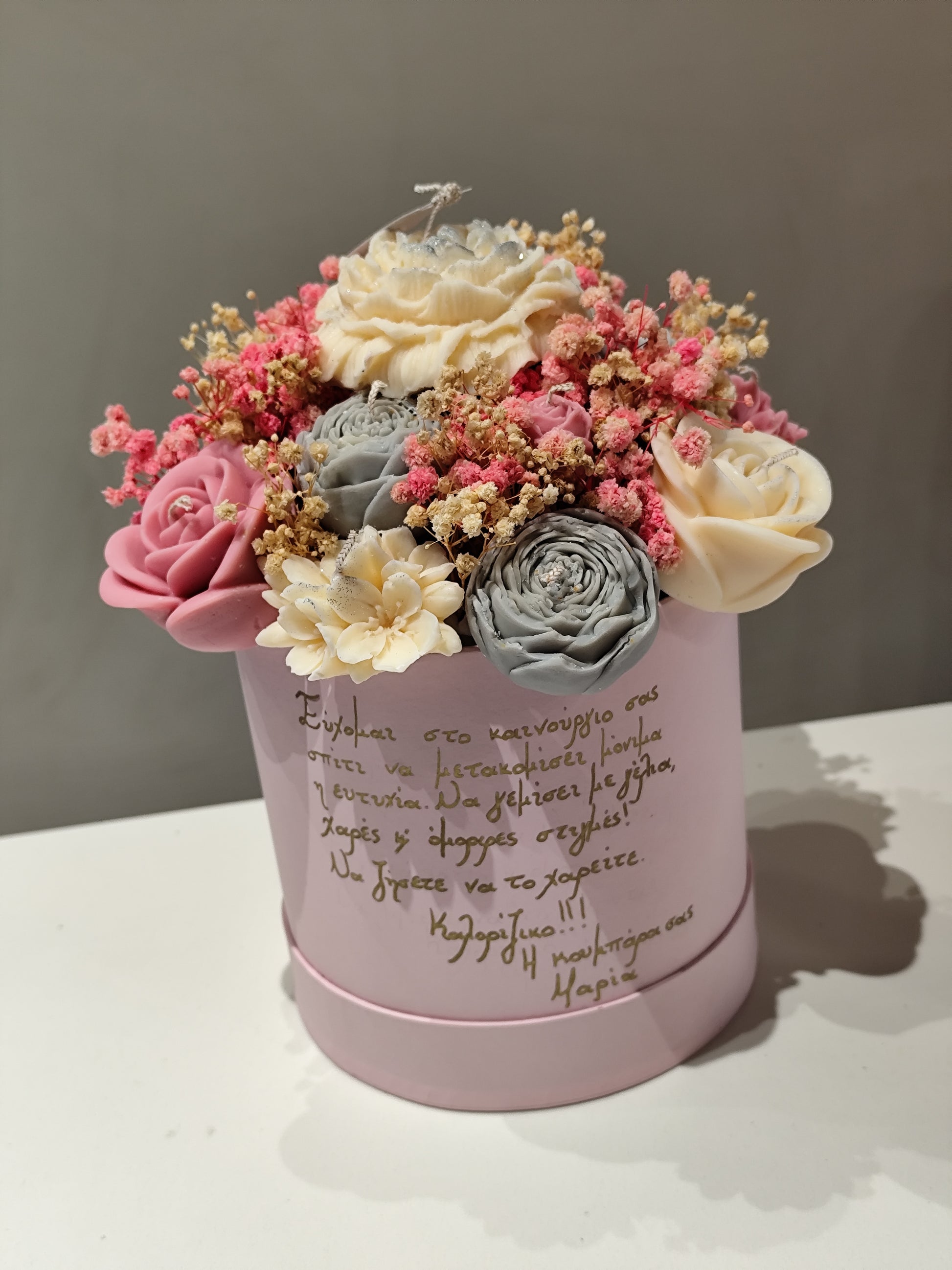 Pink candle flowers box with decorative flowers 